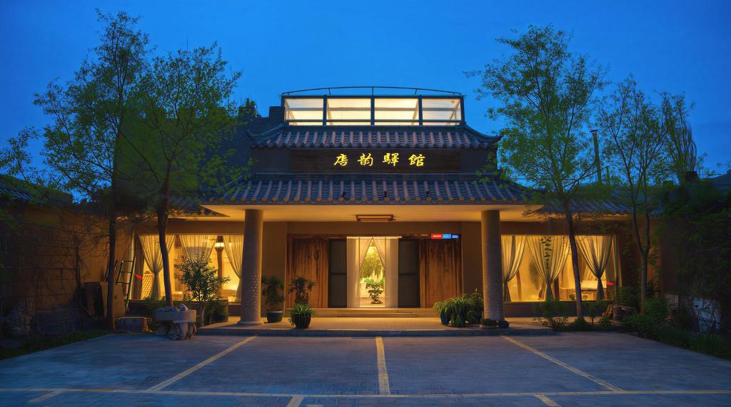 an asian building with an asian writing on it at 唐韵驿馆 in Dunhuang