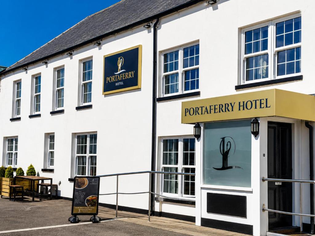 a white building with a sign for a workshopery hotel at The Portaferry Hotel in Portaferry