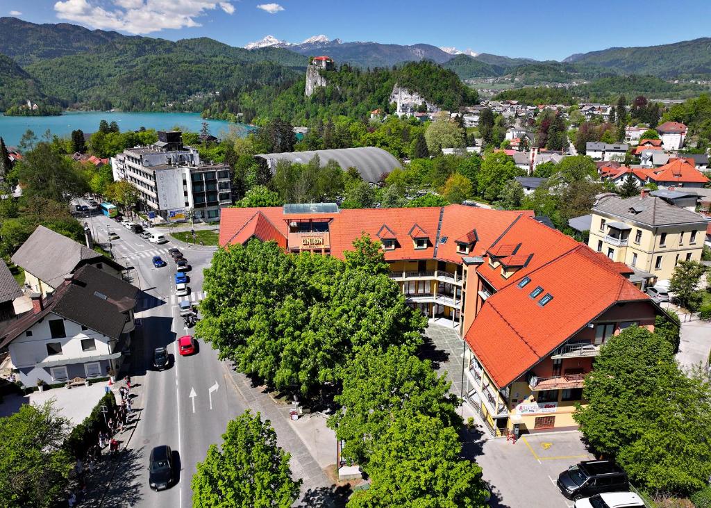 an aerial view of a town with a river and buildings at Pension Union in Bled