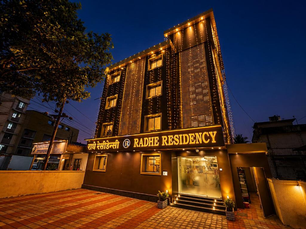 a hotel building with a sign that reads hunter residency at Hotel Radhe Residency Taloja MIDC - Only accomodate Indian citizens in Panvel