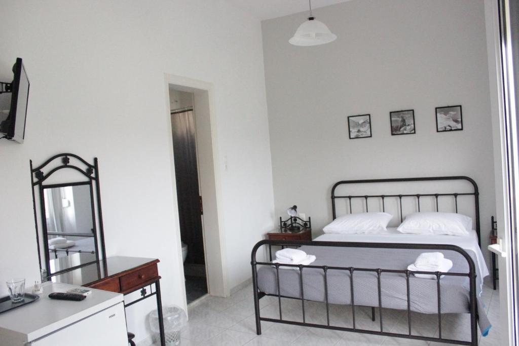 Voodi või voodid majutusasutuse Hotel Delfini toas