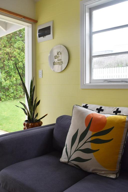 a couch in a living room with a window at Little Banks in Robe