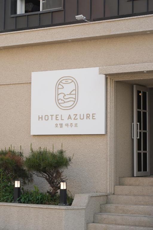 a sign on the side of a building at Hotel Azure Incheon in Incheon