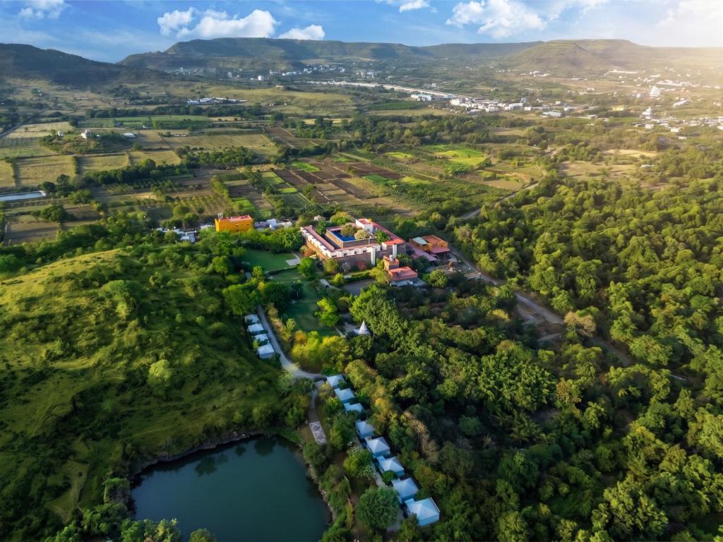 an aerial view of a house with a lake at Fort JadhavGADH -A GADH Heritage Hotel in Pune