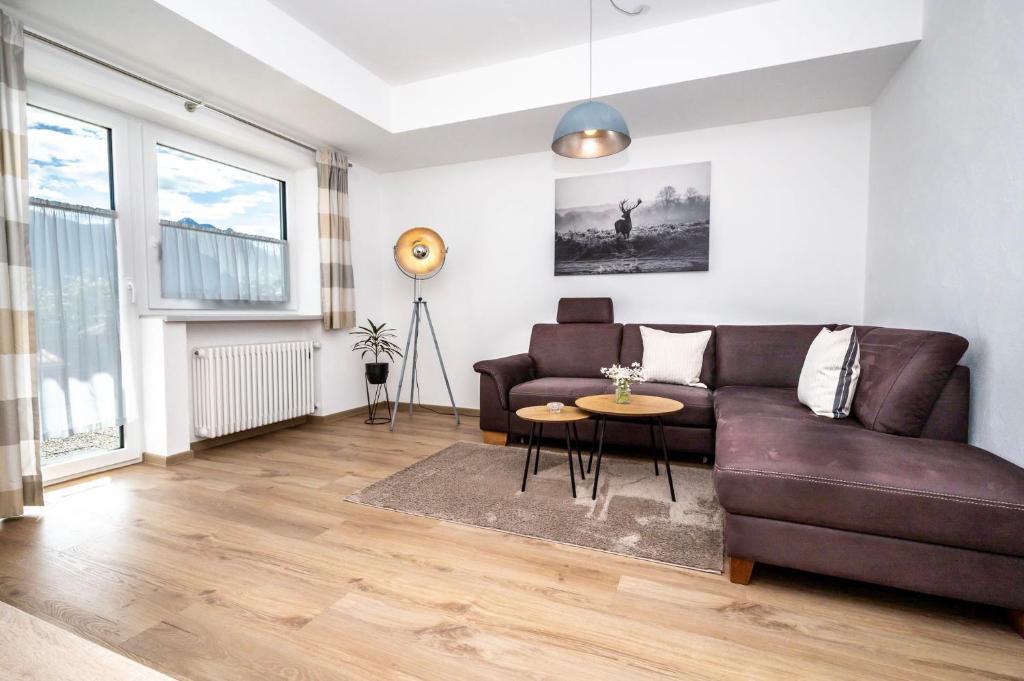 a living room with a couch and a table at Ferienwohnung Kircher in Obermaiselstein