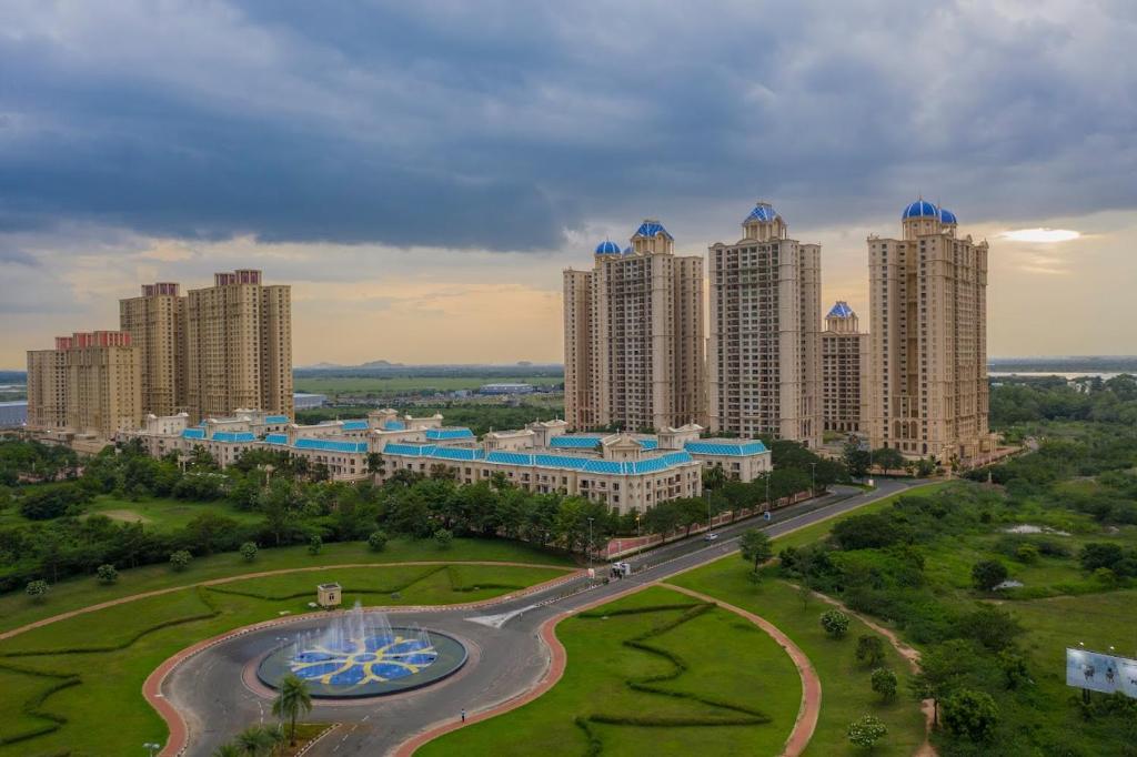 an aerial view of a city with tall buildings at Shastik Residency in Oragadam