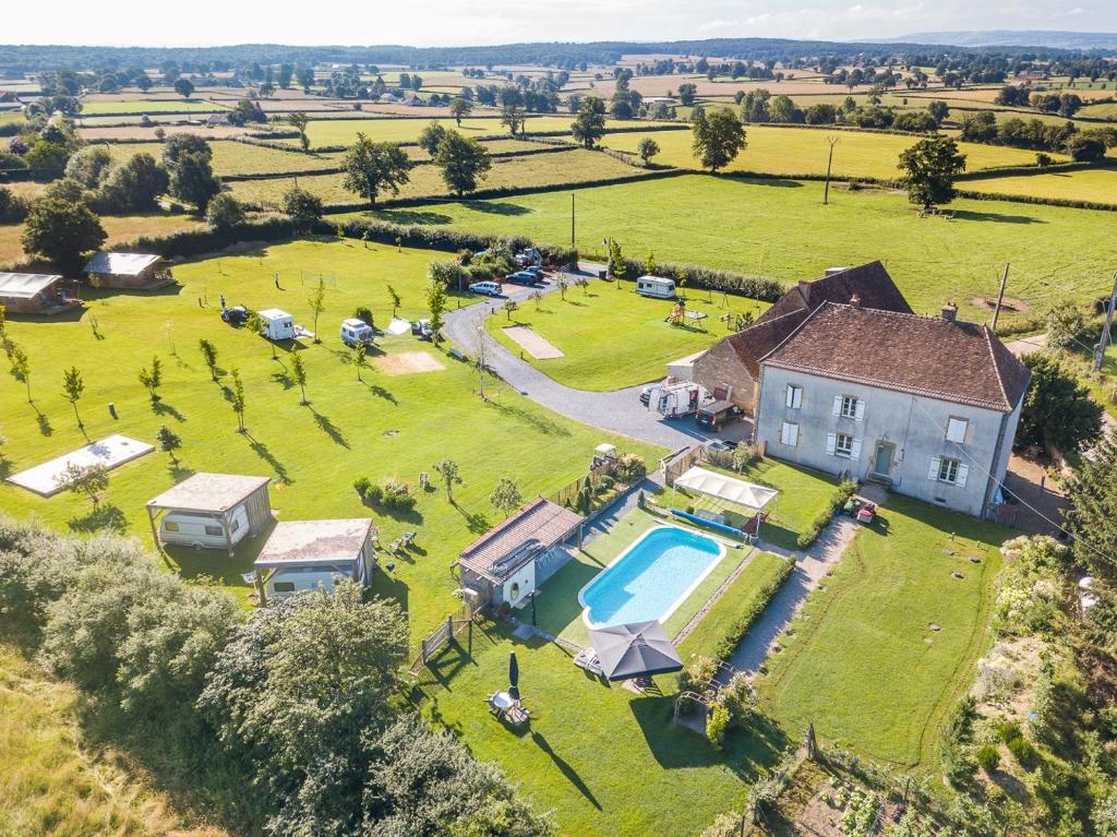 an aerial view of a large estate with a house and a swimming pool at La Maison Bornat in Versaugues