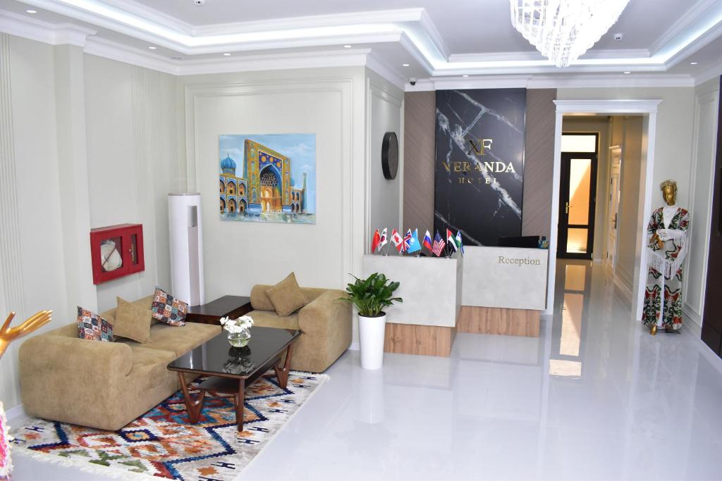 a living room with a couch and a table at Veranda XF Hotel in Samarkand