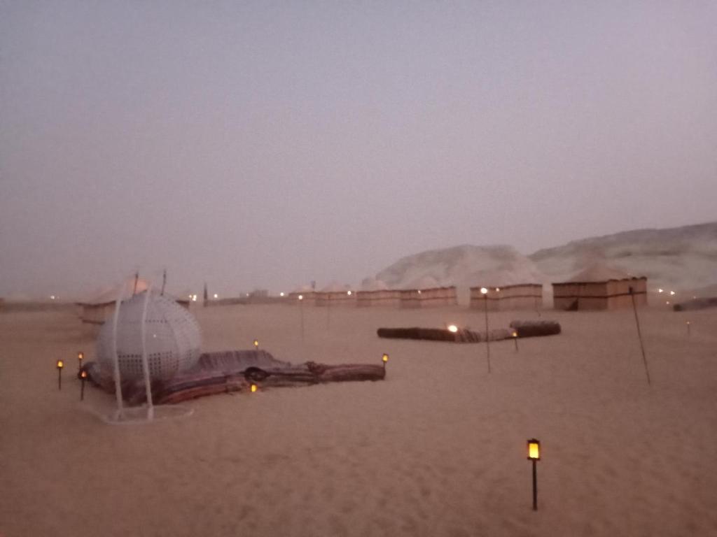 a plane laying in the sand in the desert at safari book in Bawati