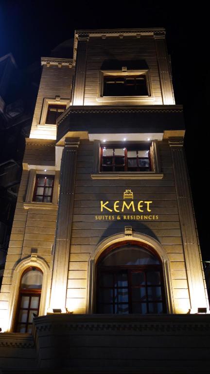 a building with a sign on the side of it at Madina Boutique Hotel in Luxor