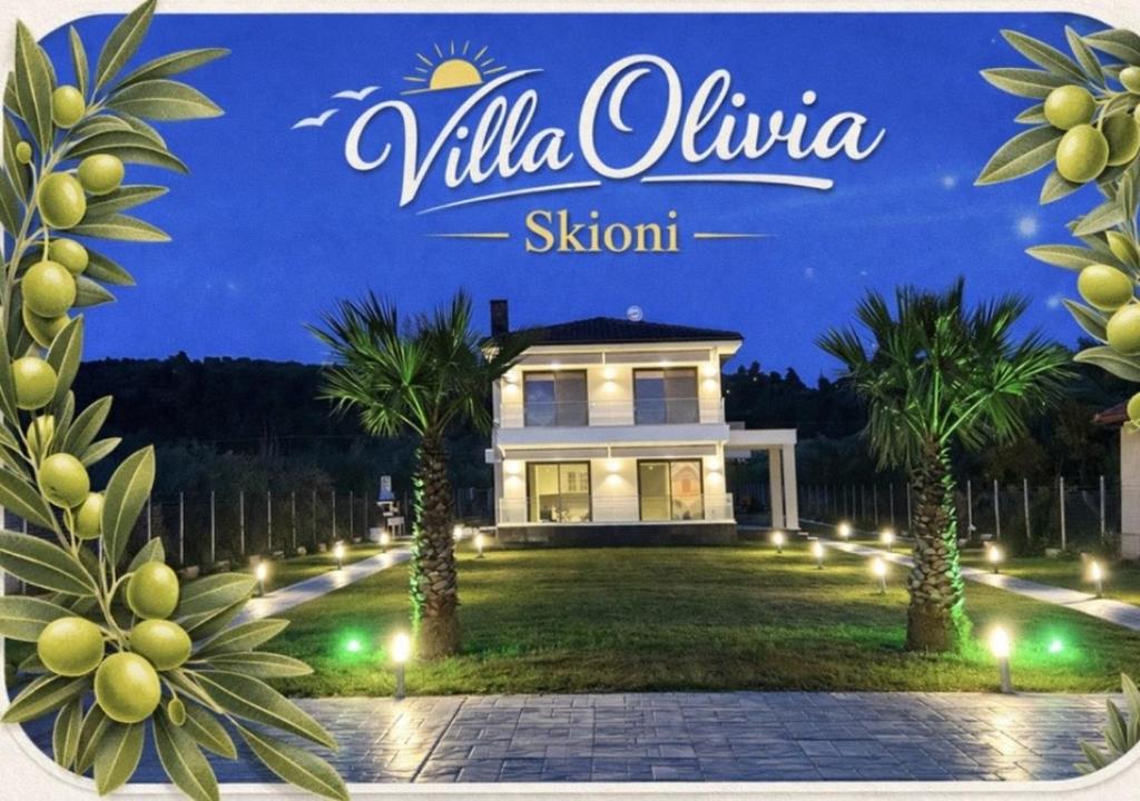 a sign for a villa alula skium at night at Villa Olivia Skioni in Nea Skioni