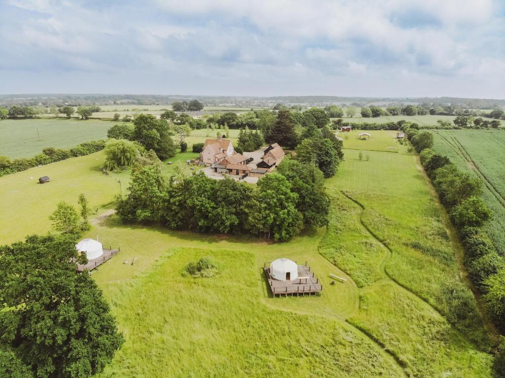 an aerial view of a house in a field at Bunkers Hill Farm in Bramfield