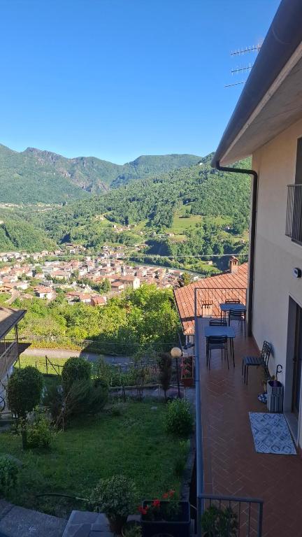 a balcony of a house with a view of a hill at Casa Lilli in Zogno