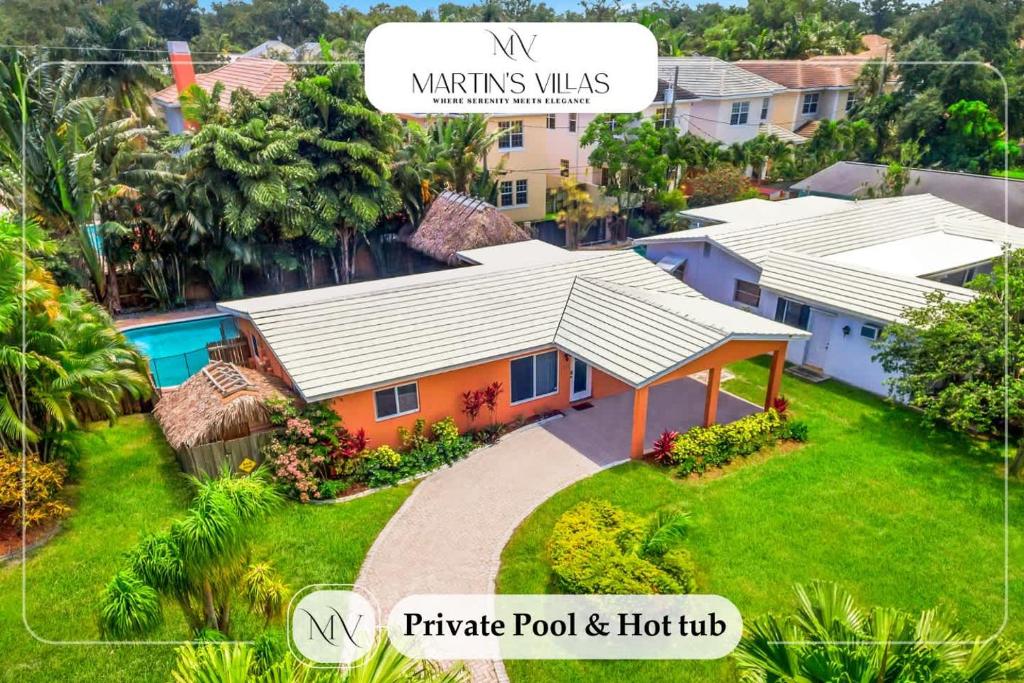 an aerial view of a house with a roof at Hidden Gem Vacation Villa w Private Pool & TikiHut in Fort Lauderdale