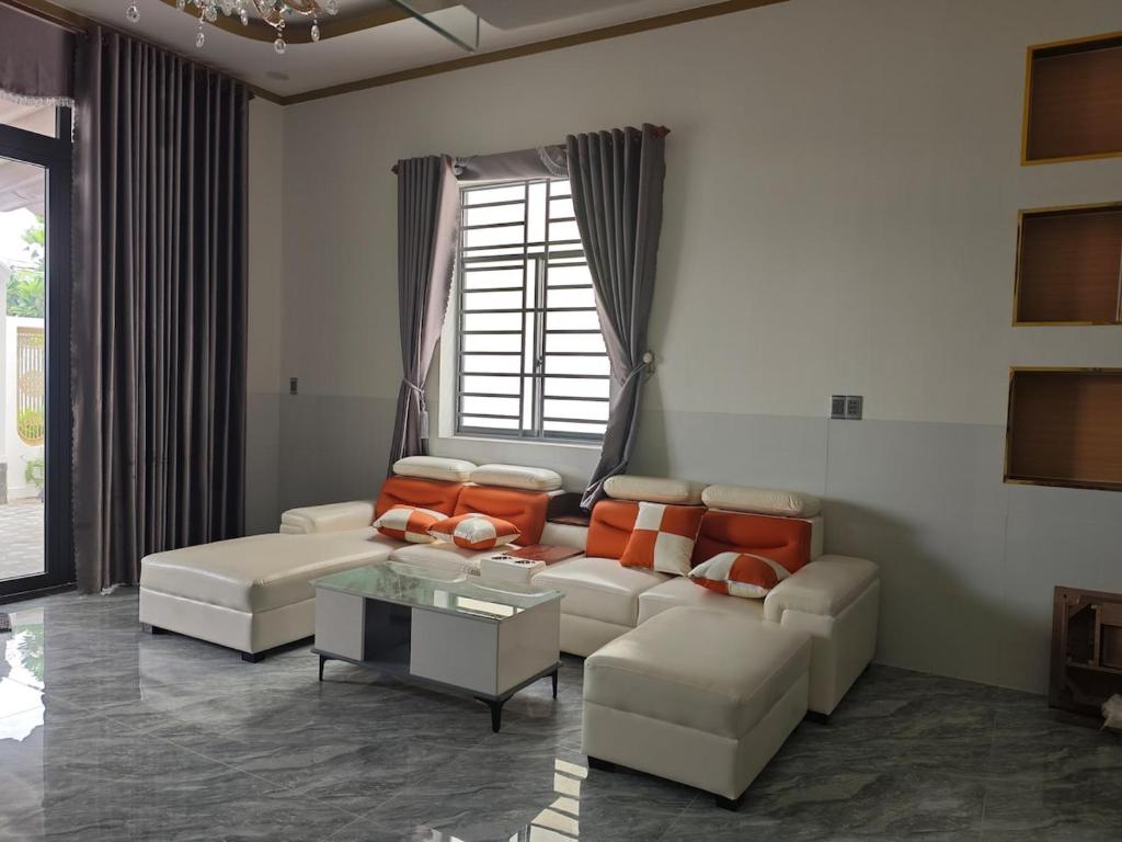 a living room with a couch and a table at MAY homestay in Phú Khương
