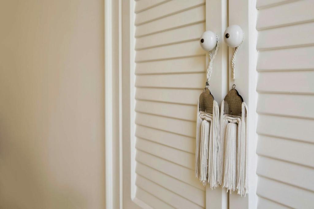a pair of tassles hanging on a wall at Domus Dejana in Gallipoli