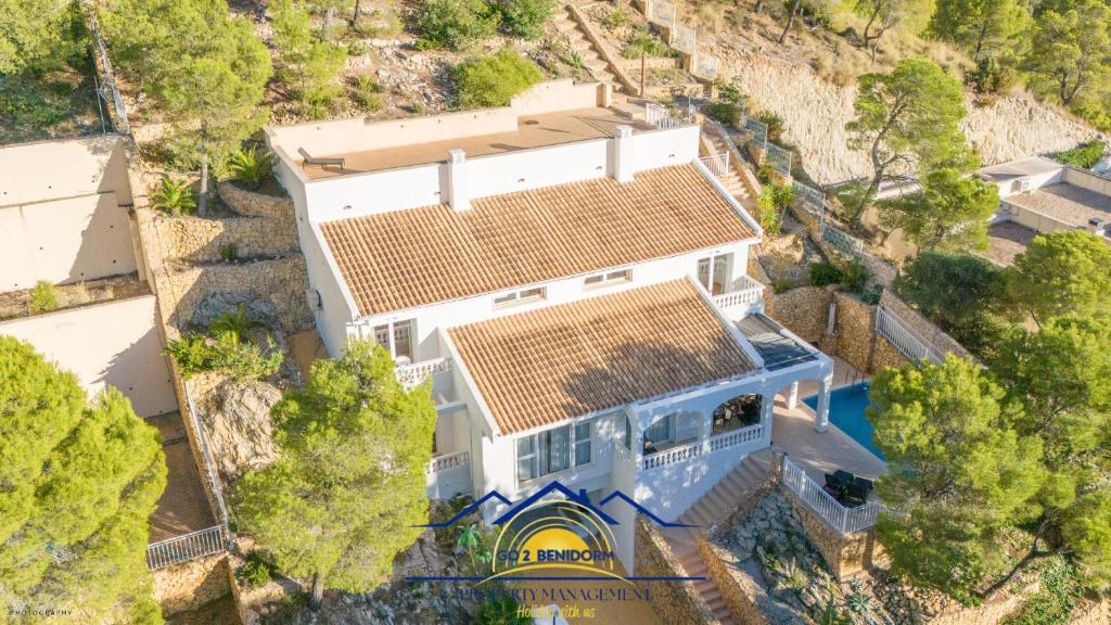 an overhead view of a large white house with solar panels on its roof at Altea Hillside Harmony in Altea