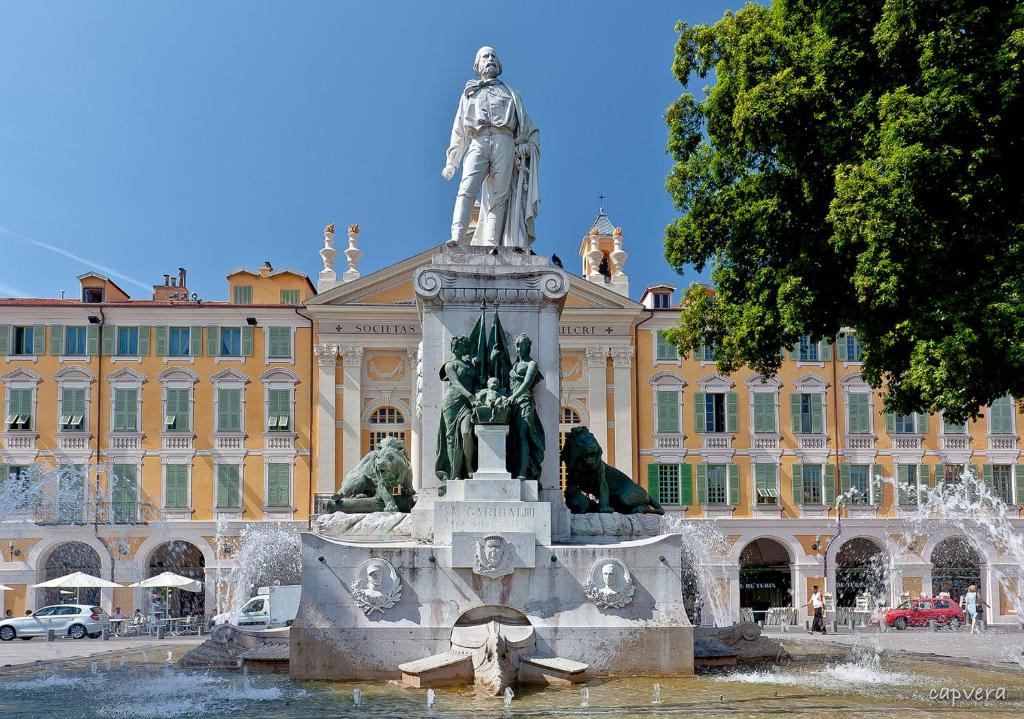 a statue in a fountain in front of a building at Apartment Lisa Acropolis Garibaldi in Nice