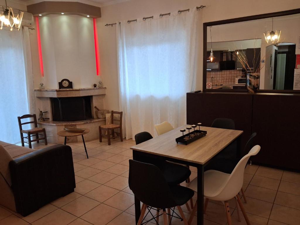 a kitchen and dining room with a table and chairs at TAKIS HOUSE in Káto Panayía