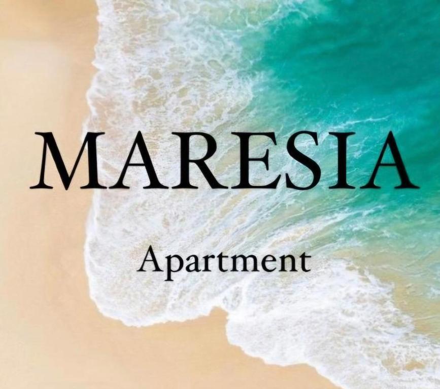 a sign that says marissa appointment on a beach at Maresia Apartment in Altavilla Milicia