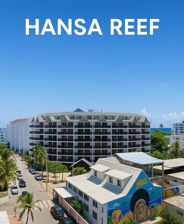 a large building with the words hamsa reef at Al Reef Apartamentos TOP in San Andrés