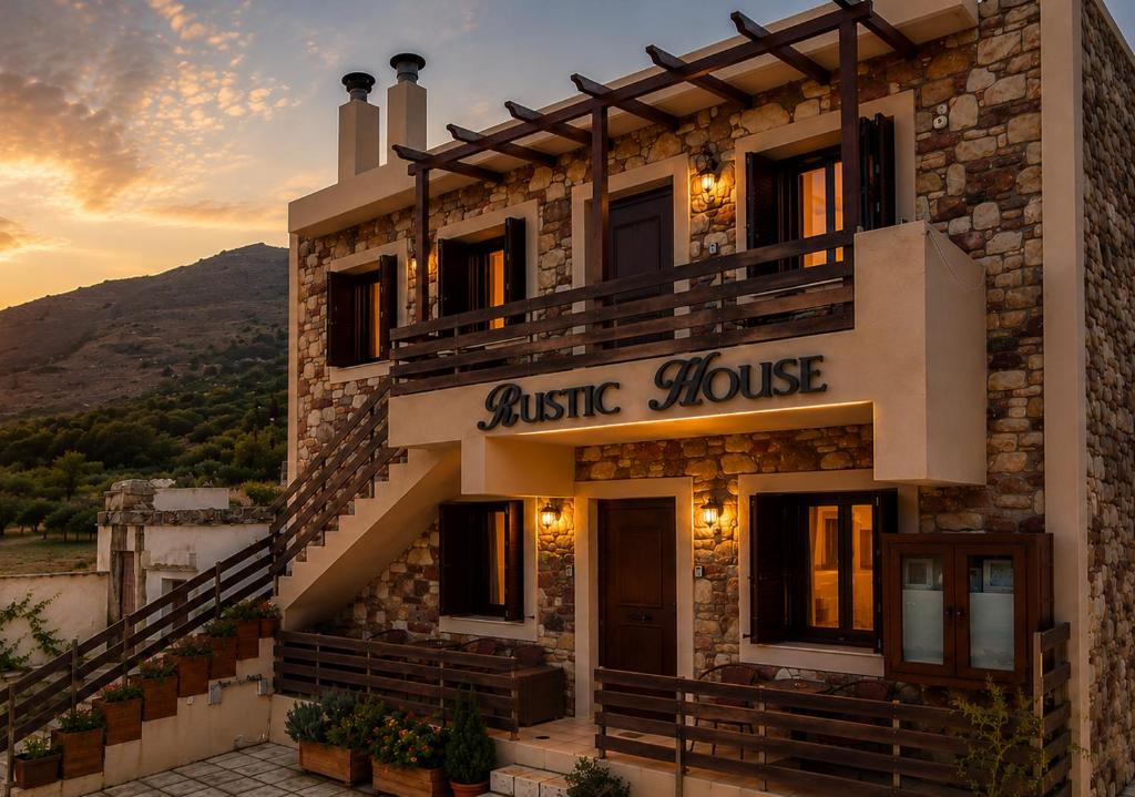 ein Gebäude mit einem Schild, auf dem „Elastisches Haus“ steht in der Unterkunft Rustic House Embonas in Émbonas