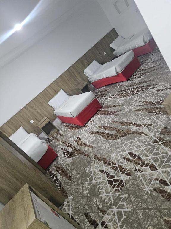 an aerial view of a room with beds on the floor at فندق الراية الماسية in Mecca