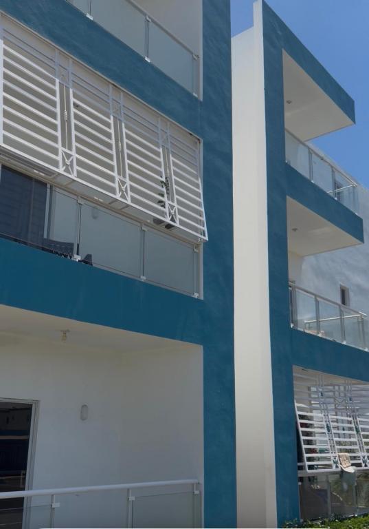 a blue and white building with a balcony at Edificio Ramírez 1 in Boca Canasta