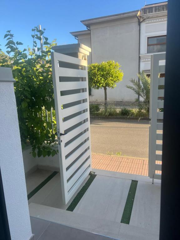 an open door to a courtyard in a building at THE PORT Guest Rooms in San Ferdinando