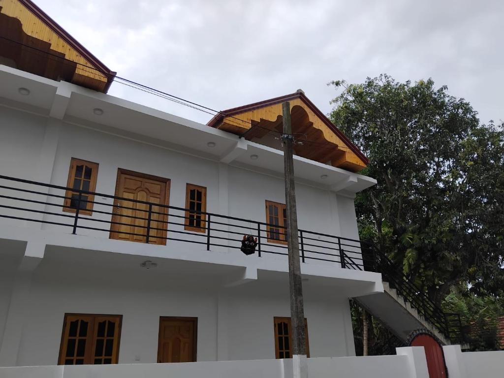 a white house with a roof on top of it at CaReville Chunnakam in Chunnakam
