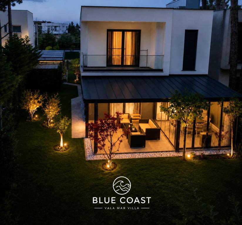 a house with a blue coast logo in front of it at Blue Coast-Vala Mar Villa in Hamallë