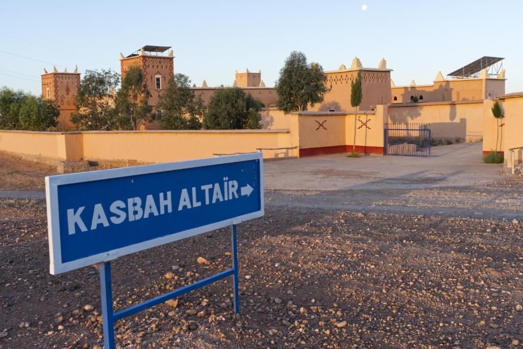 a blue sign in front of a building at KASBAH ALTAÏR in El Kelaa des Mgouna
