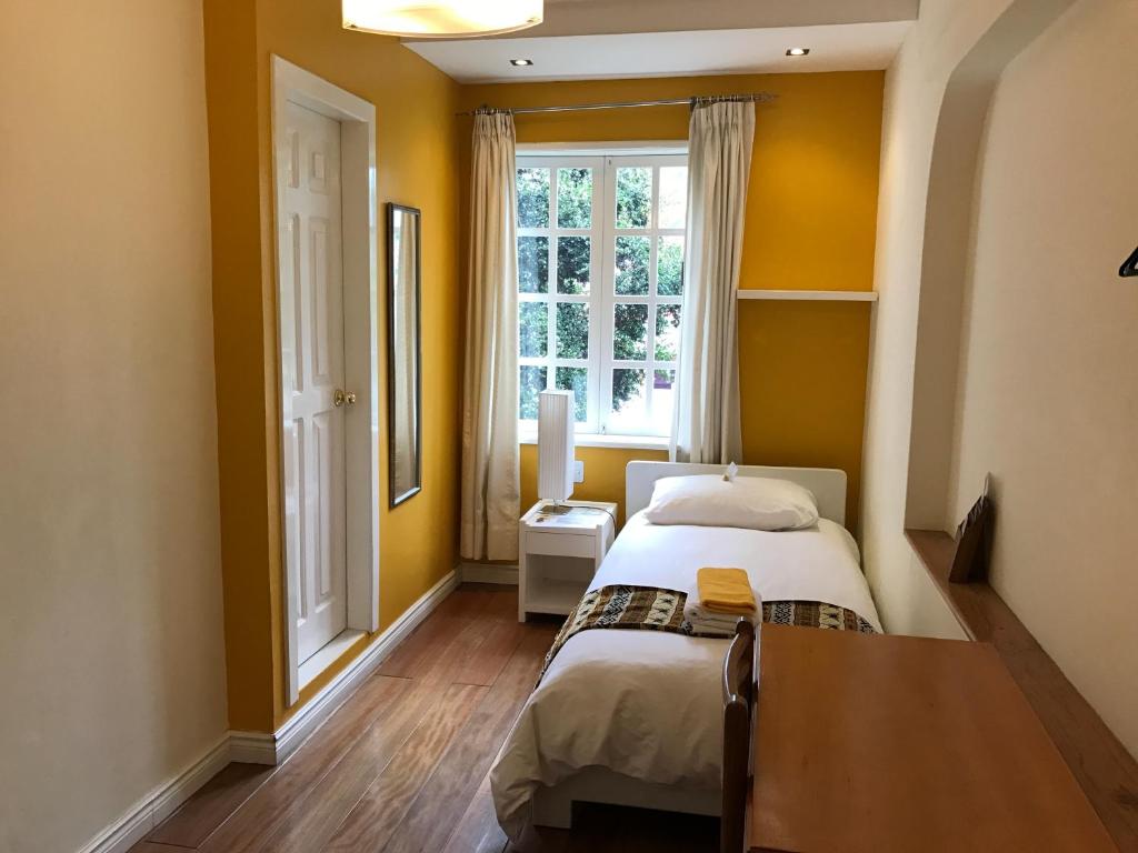 Postel nebo postele na pokoji v ubytování Hotel Cayman
