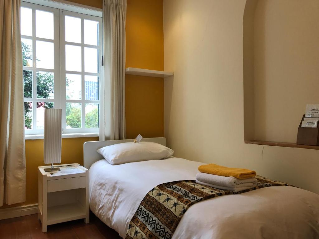 Postel nebo postele na pokoji v ubytování Hotel Cayman
