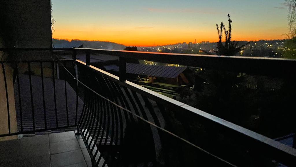 a sunset from a balcony of a building at Noclegi U Waldiego in Starachowice