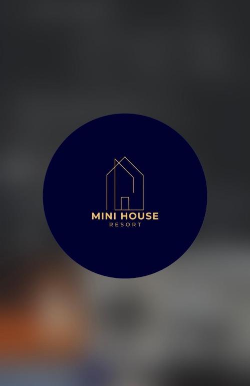a blue sticker with a mill house logo on it at Mini House in Shahumyan