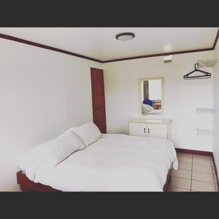 Postel nebo postele na pokoji v ubytování Casa Kibi Kibi