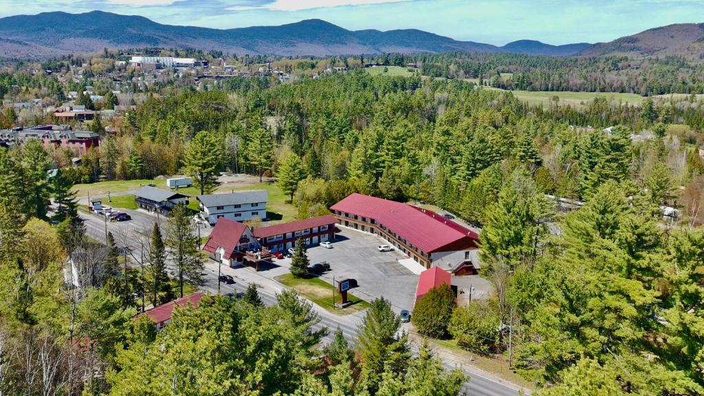 an aerial view of a building in the mountains at Rodeway Inn Lake Placid South in Lake Placid