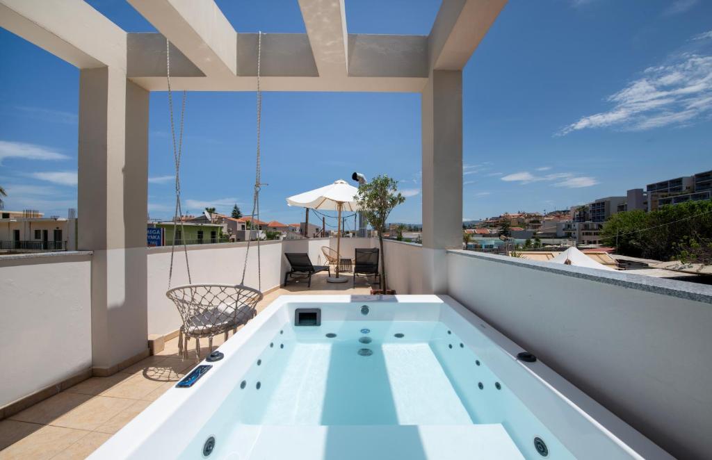 a swimming pool on the balcony of a house at United Cretan Villas & Spa in Agia Marina Nea Kydonias