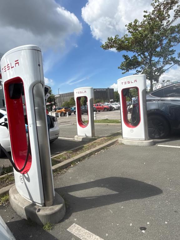 a row of parking meters in a parking lot at La Motte Feuilly in La Motte-Feuilly