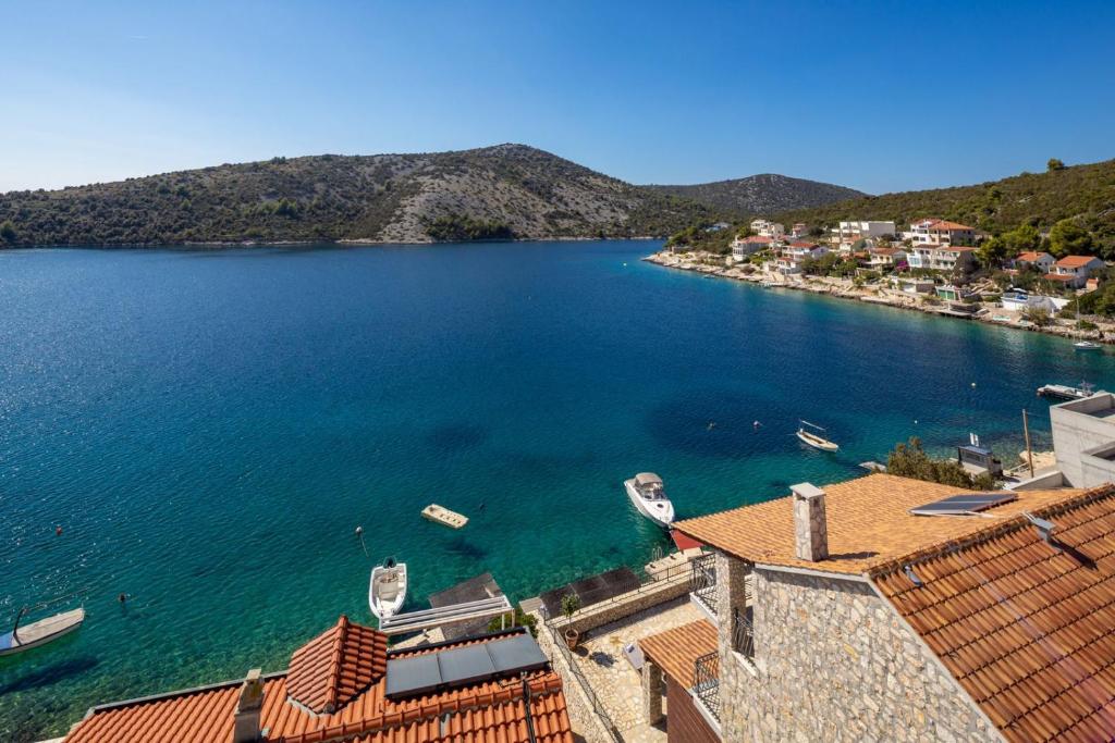 a view of a large body of water with boats in it at Sunset Terrace Vinisce in Vinišće
