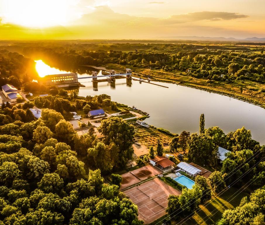 an aerial view of a river with a bridge at Tisza Garden Park in Tiszalök
