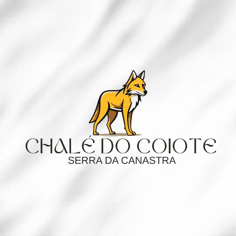 a logo for a chiba do coyote company at Chalé do coiote! in São Roque de Minas
