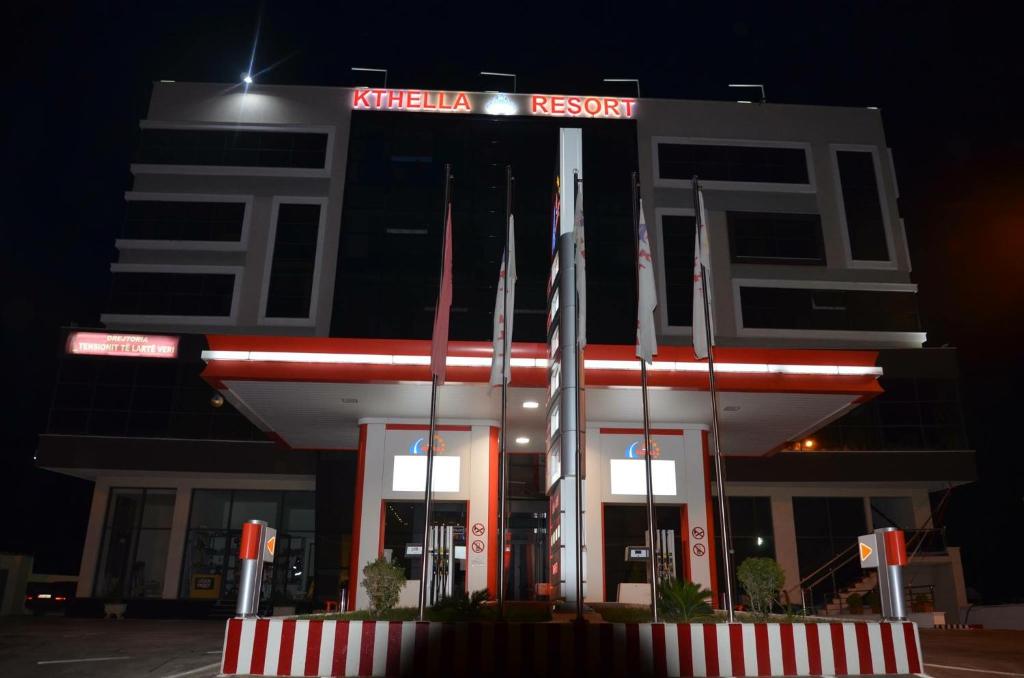 a building with a sign in front of it at Hotel KTHELLA in Rrëshen
