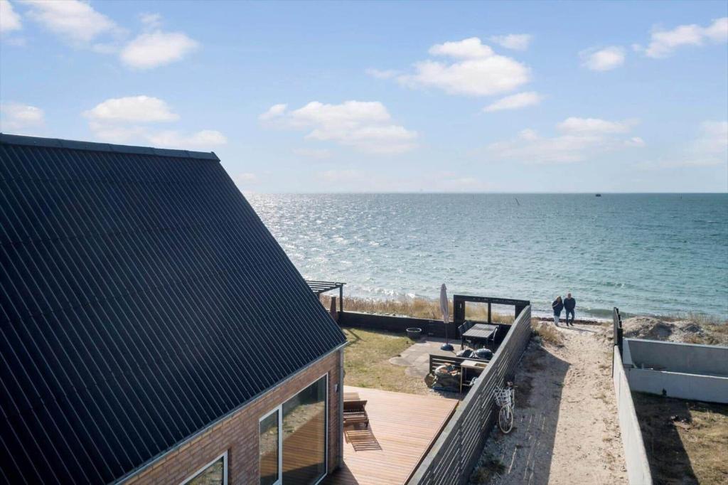 a house on the beach next to the ocean at M411-Gedser-Sdr-Boulevard-6-B in Gedser