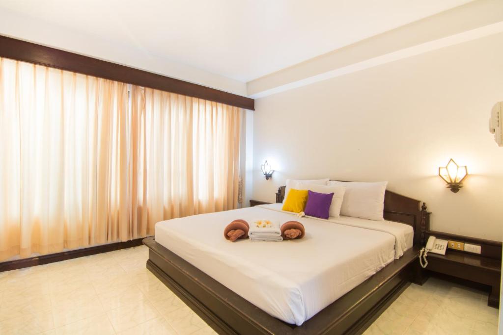 Postel nebo postele na pokoji v ubytování Samui First House Hotel