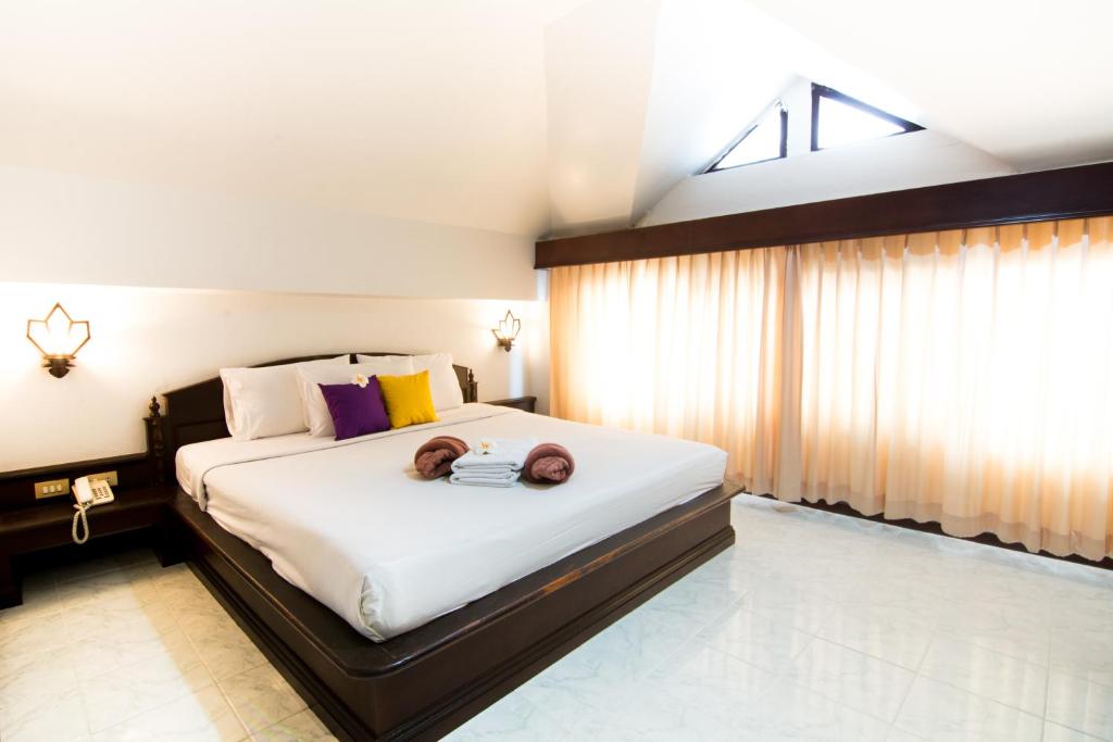 Postel nebo postele na pokoji v ubytování Samui First House Hotel