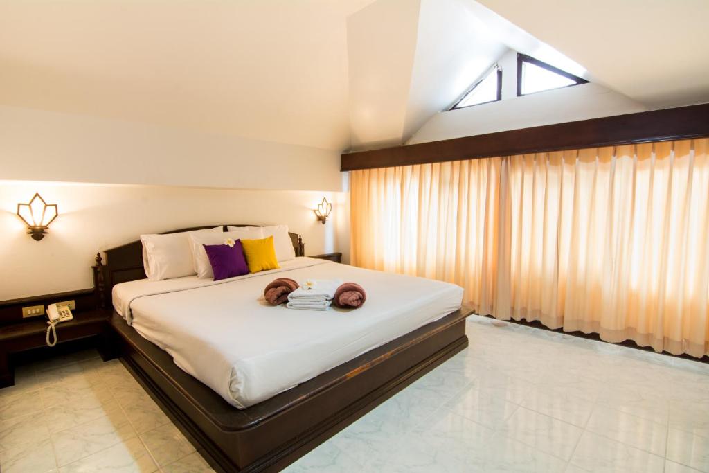 Postel nebo postele na pokoji v ubytování Samui First House Hotel