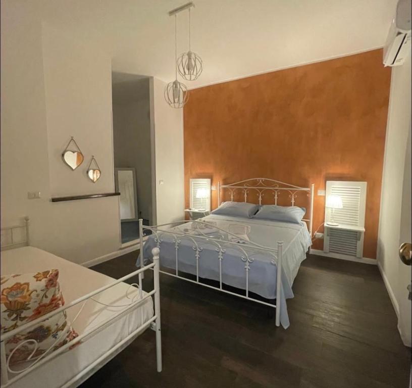 a bedroom with a bed and a mirror at Civico 210 in Itri