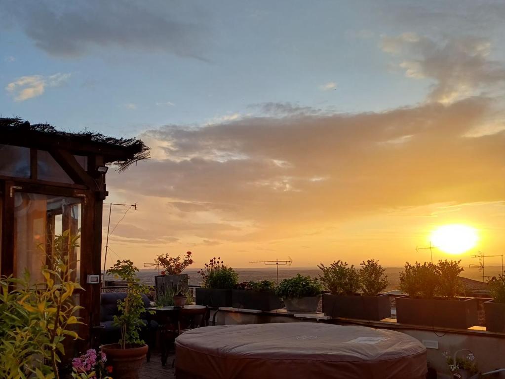 a view of the sunset from a rooftop patio at Il Campanile in Tivoli